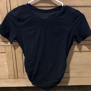 Lightly worn, size 4 black LULULEMON short sleeve top.